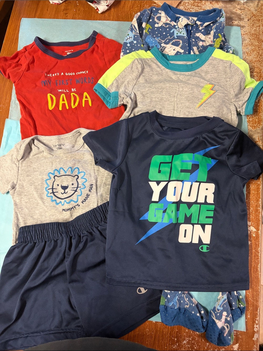 18mth boys lot. 2 T-shirt. 1 short. 2 onesies and 1 long sleeve sleeper